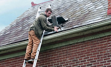 Worker fixing Gutter